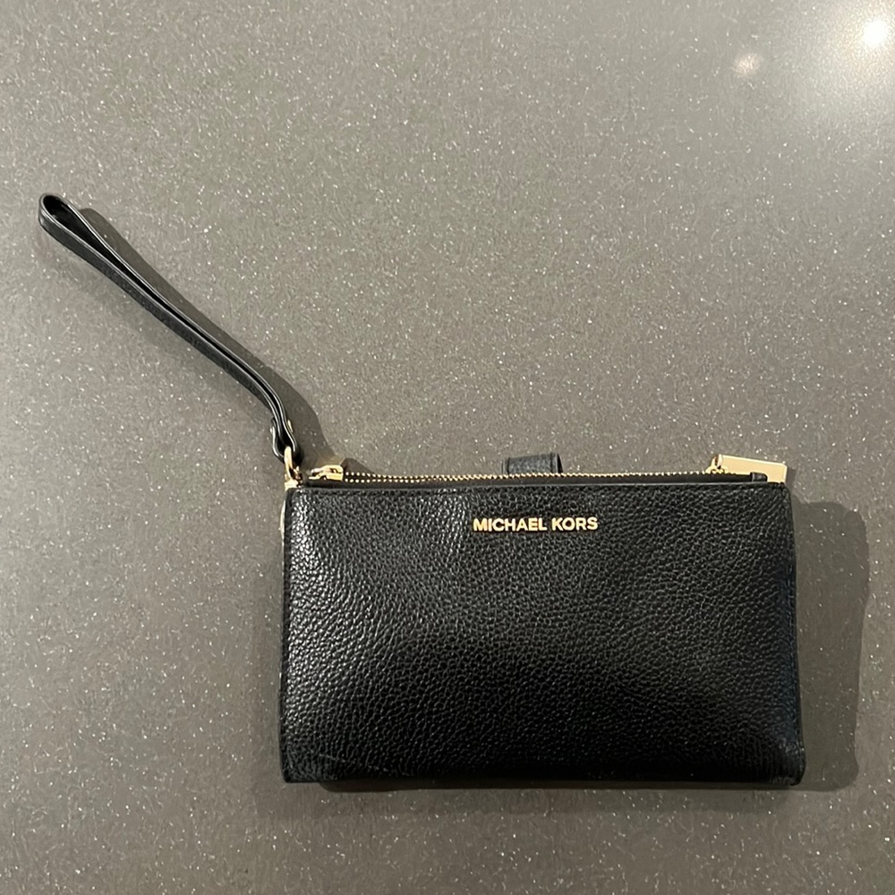 Black Michael Kors wristlet with gold hardware